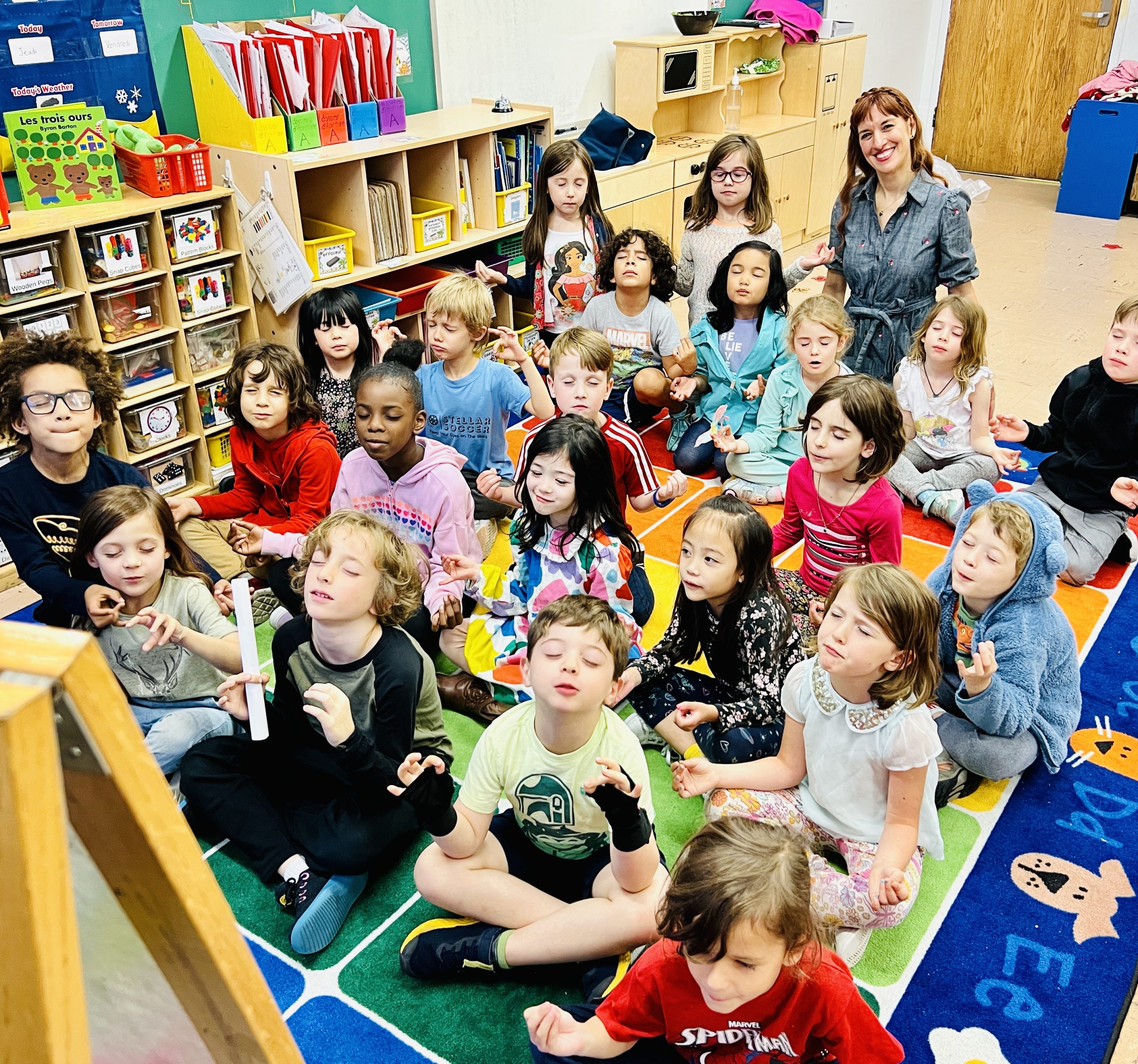 Children practicing yoga in their classroom.