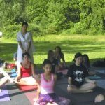 Teenagers in group meditation practice.